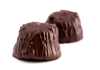 Two Dark Chocolate Truffles Isolated on a White Background