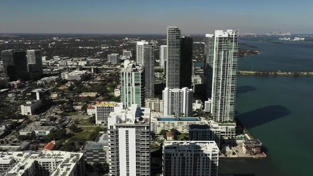 Flying over highrise buildings in Miami