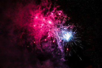 Fototapeta na wymiar Firework Display with blue and pink colours