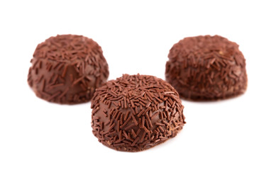 Three Milk Chocolate Truffles in a Row on a White Background