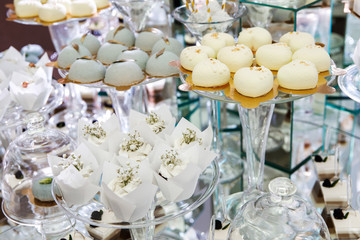 Festive table for newlyweds and guests. Dessert table for a wedding party