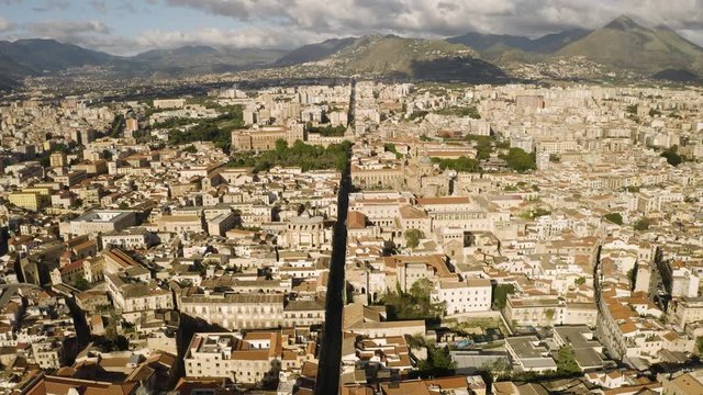 Flight in the historic part of Palermo, early sunny morning over the Corso Vittorio Emanuele, Cattadrale Santa Vergine Maria Assunta, Palazzo dei Normanni. Sicily, Italy. May 2019. Aerial shot