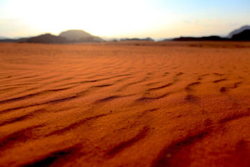 Fototapeta na wymiar background of red sand on Wadi Rum in Jordan