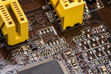 A microcircuit motherboard with chips. Macro photography