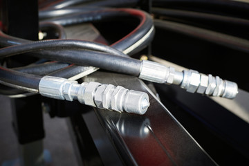 Fototapeta na wymiar Closeup of hoses and valves for the hydraulic system