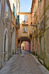 Fototapeta na wymiar Sant'Agata de 'Goti, Italy, 02/29/2020. A narrow street between old houses of a medieval village.