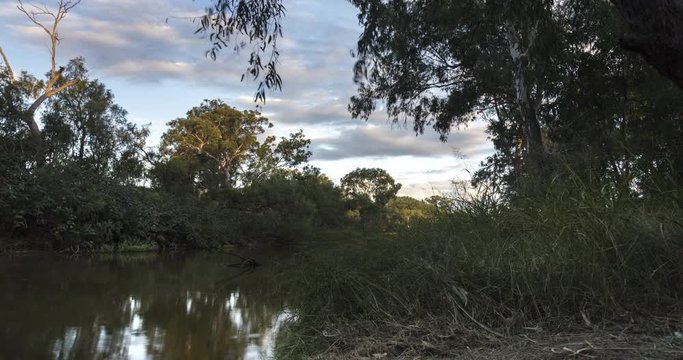 Waiting for the night at Queensland Australia,  Motion Control time lapse of a Sunset on a small River in the outback of Queensland, Australia at the village of Moree near the Pilliga National Park