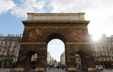Fototapeta na wymiar Paris, the porte Saint-Martin, beautiful ancient gate near the Grands Boulevards.
