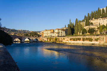 Fototapeta na wymiar Verona bridge and Adige river view, Veneto region of Italy