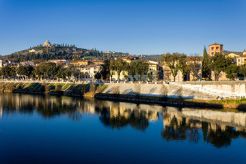 Fototapeta na wymiar View on the city of Verona from the Adige river that crosses it