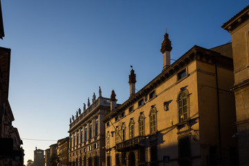 Fototapeta na wymiar Ancient buildings of Verona illuminated by the setting sun