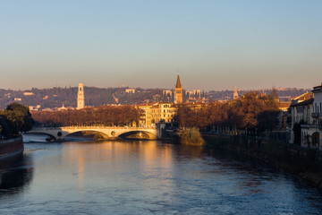 Fototapeta na wymiar View of Verona and the Adige river from the Castelvecchio bridge, also known as the Scaliger bridge at the sunset