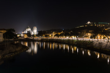 Fototapeta na wymiar View of Verona and the Adige river from the Castelvecchio bridge, also known as the Scaliger bridge at night