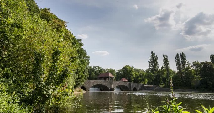 Time lapse on the river elster at the city of Leipzig. A motion control timelapse at the elsterwehr in the beautiful green city of leipzig, Saxony, Germany on a summer day.