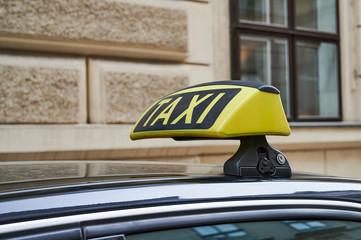 yellow taxi sign on a car in Vienna