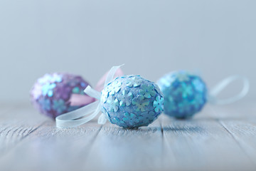 Colorful Easter Eggs on wooden background.