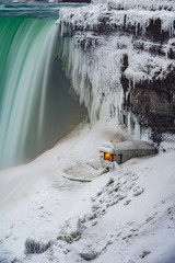 Snow covered Horseshoe Falls at Niagara Falls in the winter.