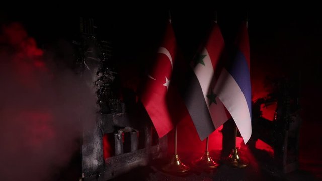 Closeup, flags on dark background. Concept of crisis of war and political conflicts between nations. Selective focus