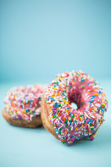 Pink donuts on blue background