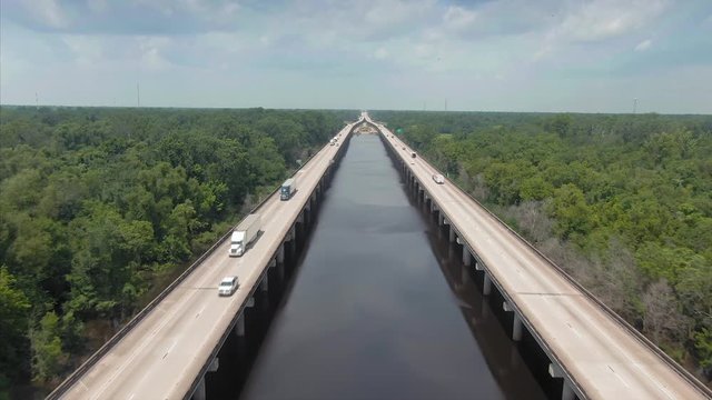 Swamp river and Interstate 10 Freeway cutting through it. New Orleans, Louisiana, USA