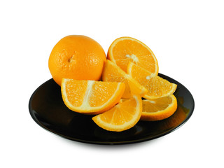 Juicy ripe oranges, whole, cross section and slices on black glossy plate isolated on white...