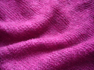 Plakat Pink knitted fabric. Textile background. Pink abstract background.