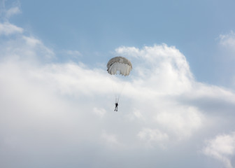 Paratrooper in the sky with a parachute
