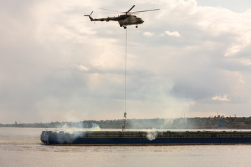 A military helicopter picks up a soldier
