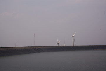 wind turbines at sunset