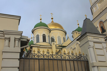 Gate of Holy Trinity Cathedral with domes with crosses, Dnipro, Ukraine.