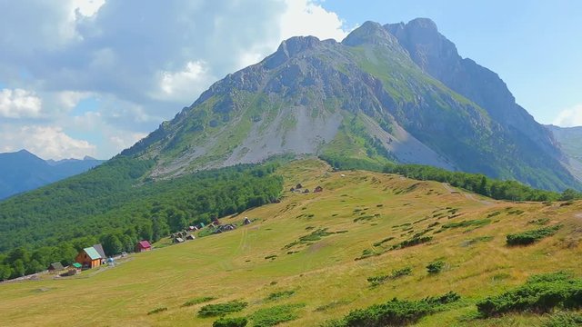 Mountain areas in summer. Mountain Kom, Montenegro. Beautiful views of the mountain peaks and the village