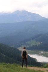 hiker on the top of mountain