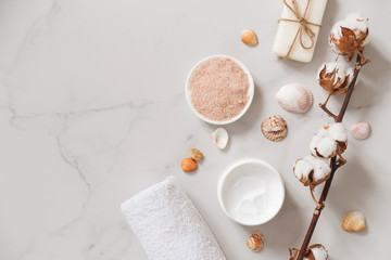Spa cosmetics set on white marble background from above. Beauty blogger concept. Copy space - obrazy, fototapety, plakaty