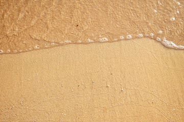 sea water and sand on the shore. View from above.