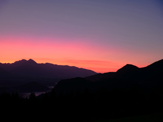 Fototapeta na wymiar View on the beautiful sunrise over the majestic hills with the Lake Bled in Slovenia