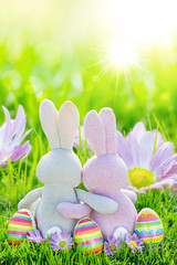 easter eggs in green grass with easter family couple