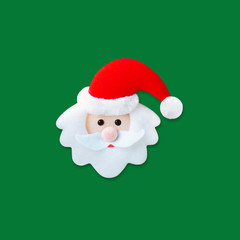 Santa Claus. Face of Santa Claus in red hat isolated on green background