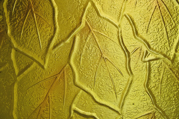 Three dimensional decorative glass with gold leaf pattern