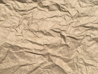 Brown crumpled paper background with copy space for Design. Wrinkled wallpaper Pattern