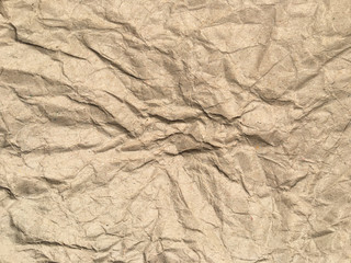 Brown crumpled paper background with copy space for Design. Wrinkled wallpaper Pattern