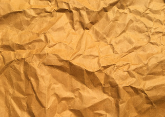 Old brown crumpled paper background with copy space for Design. Closeup view