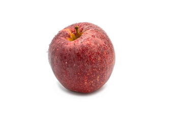 fresh red apple with drops of water, isolated on white background