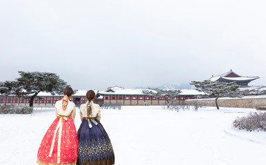 Gyeongbokgung Palace in Winter with Korean national dress Seoul South Korea
