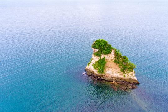 Huge Rock with Shaped Chesse, Know as The Small Quesillo Island in the Pacific Ocean in Front of the Tumaco Beach