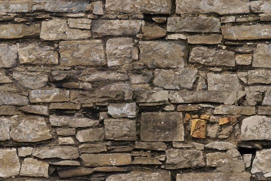 seamless texture of the old stone wall for the designer, rough gray background