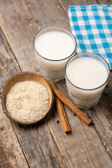 Mexican rice horchata with cinnamon on wooden background