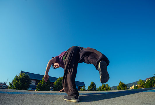 Parkour man doing tricks outdoors