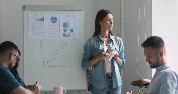 Nervous young female conference speaker feeling unconfident before presentation.