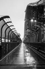 Black and white photo of Sydney Harbour Bridge in the rain