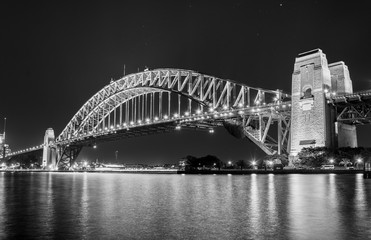 Black and white photo of the Sydney Harbour Bridge at night